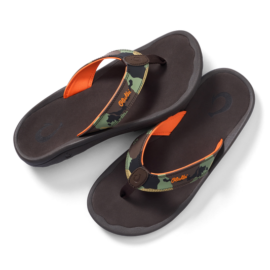Pair of dark brown thong sandals with camo and orange straps, brown button closure, and cushioned footbeds.