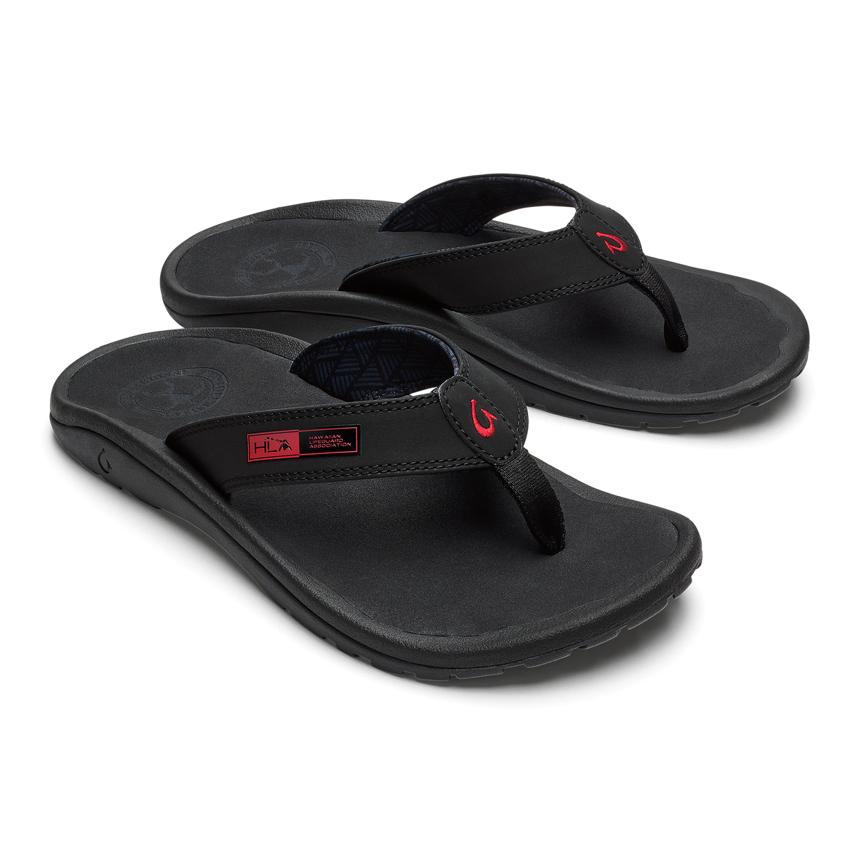 Black thong sandals with padded footbed and red accent logo on straps.