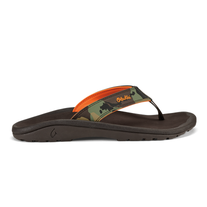 Thong sandal with dark brown sole, camo and orange strap with orange accent on upper strap.