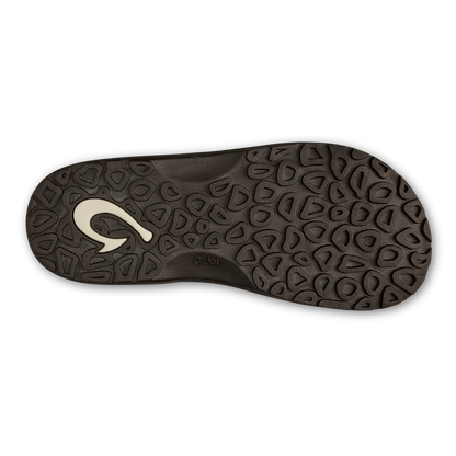 Dark brown sole with geometric tread pattern and white curved logo on the heel.