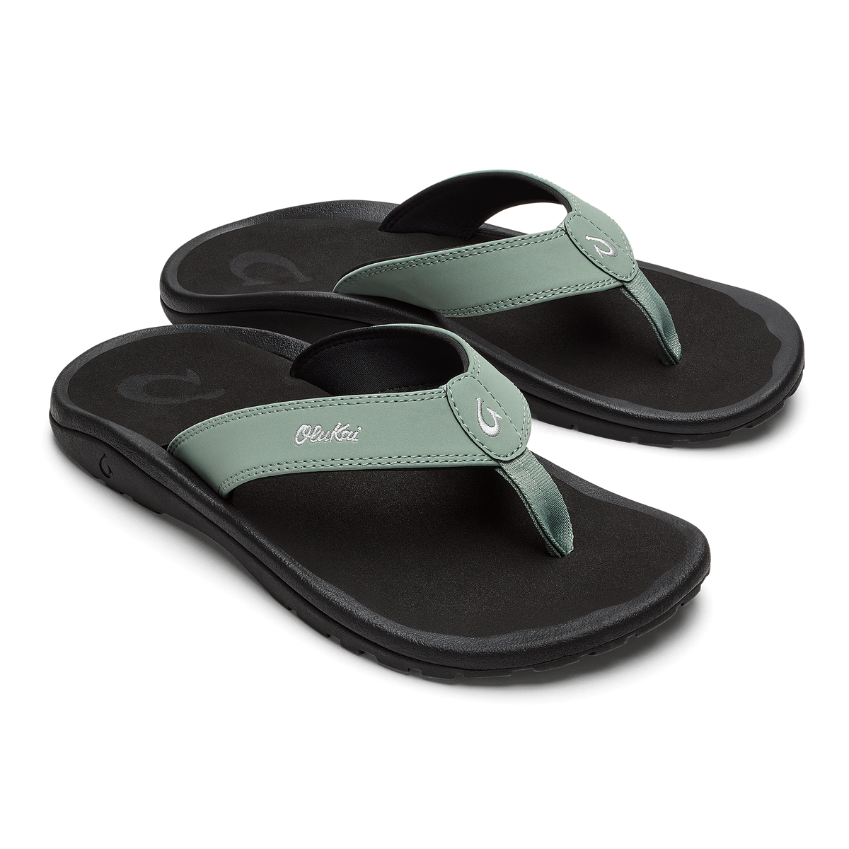 Pair of seagreen and black thong sandals with cushioned soles and decorative toe posts.