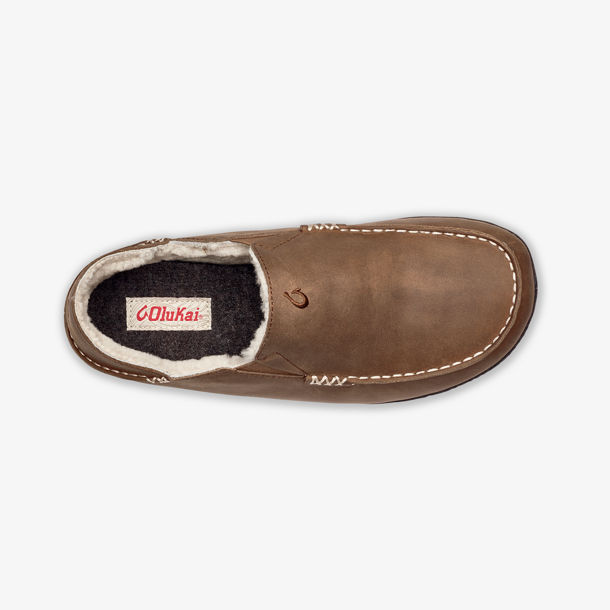 Toffee-colored leather slipper with dark wool lining and cream-colored stitching, shown from above.