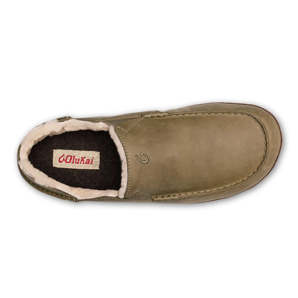Tan and dark brown slipper with fleece lining visible from above, showing moc-toe construction and brand label inside.