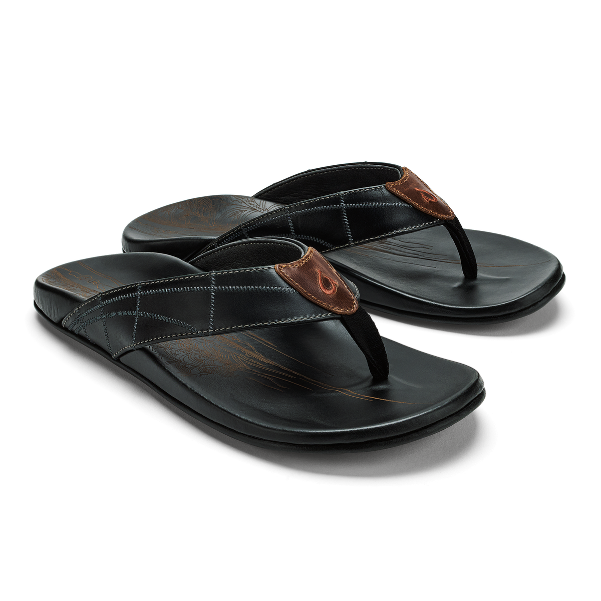 Black thong sandals with brown leather toe post and white stitching detail on padded footbed.