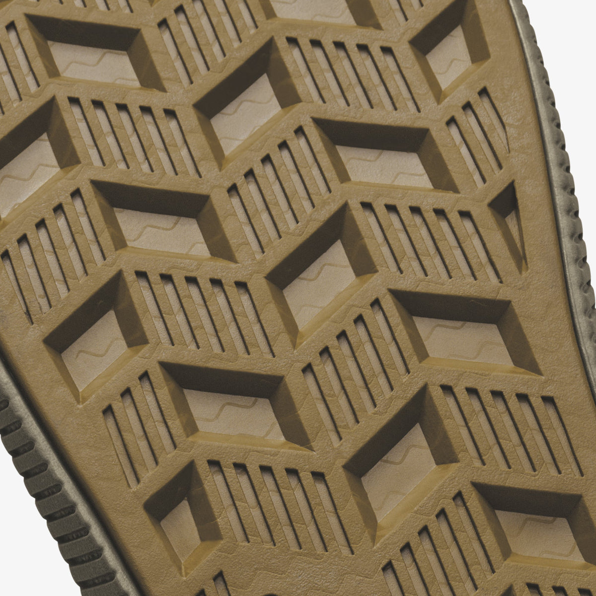 Tan rubber sole with geometric tread pattern featuring rectangular cutouts and parallel grooves.