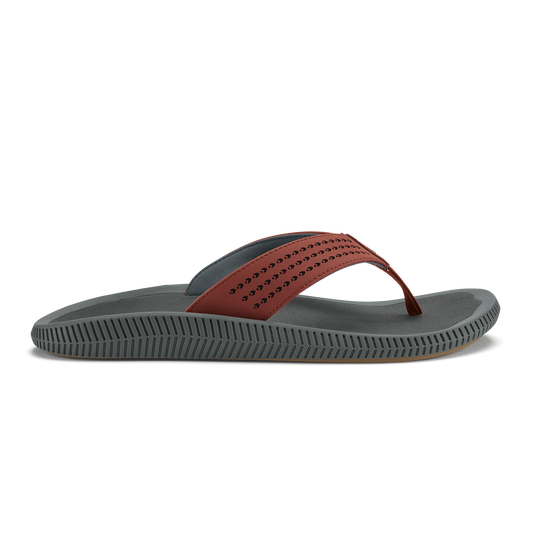 Gray thong sandal with perforated rust-colored upper strap and textured sole.