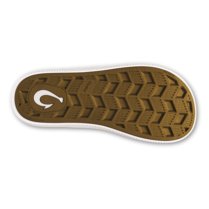 Sole view of trench blue sneaker with tan tread pattern and white curved logo.