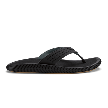 Black thong sandal with perforated upper strap and textured sole.