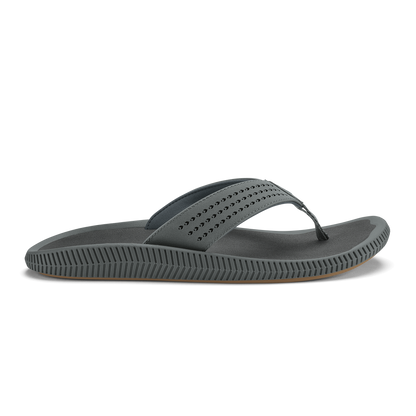Gray thong sandal with studded upper strap and textured sole in side view.