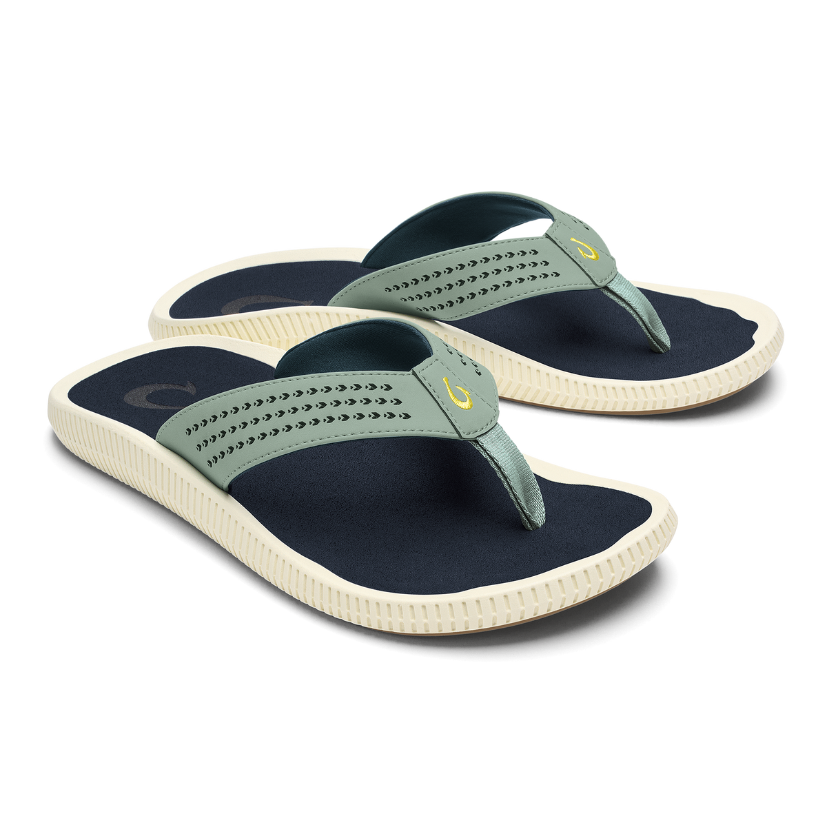 Pair of seagreen and navy thong sandals with textured straps and cream-colored ridged soles.