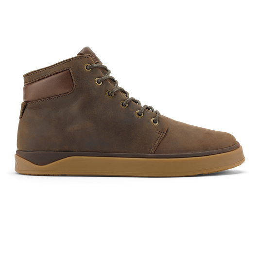 Dark brown leather high-top boot with toffee-colored sole and brass eyelets, shown from the side.