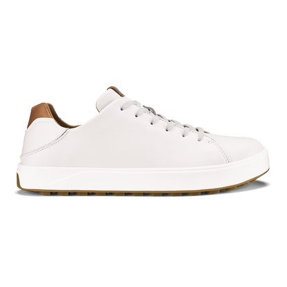 White leather low-top sneaker with tan heel tab and white laces on white sole.