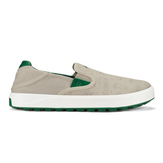 Beige canvas slip-on sneaker with white midsole and green heel counter and outsole.