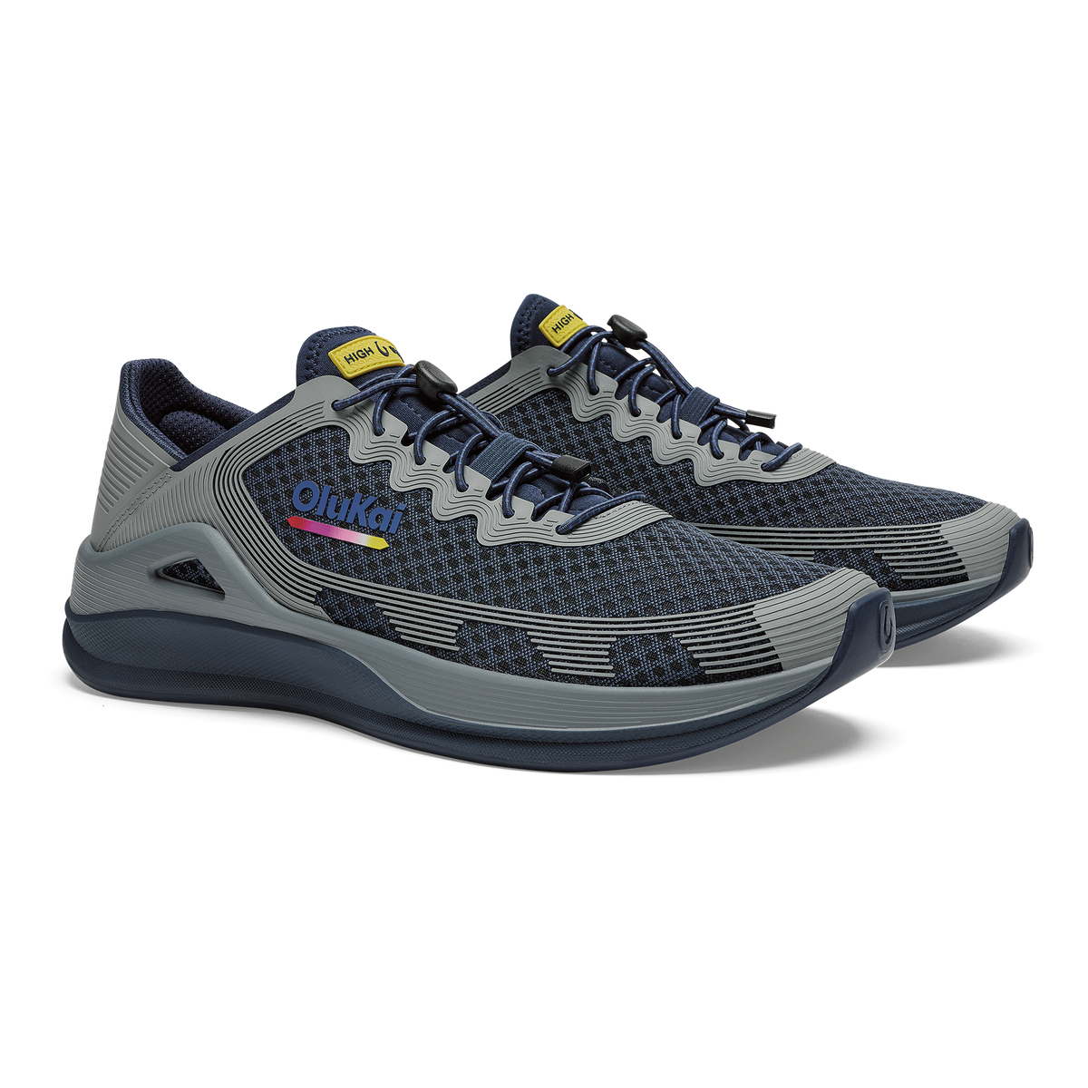 Navy and gray mesh running shoe with wavy stripe detailing, yellow tongue tab, and dark sole.