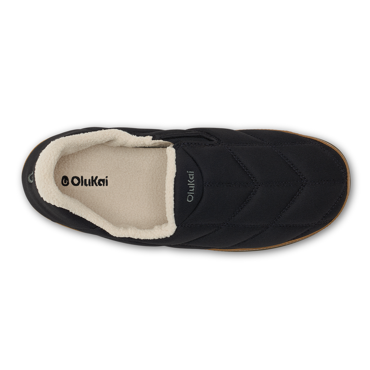 Black slip-on bootie with cream fleece lining and tan sole, shown from above.