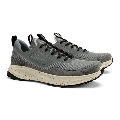 Grey mesh and suede lace-up trail running shoe with speckled cream midsole and black accents.