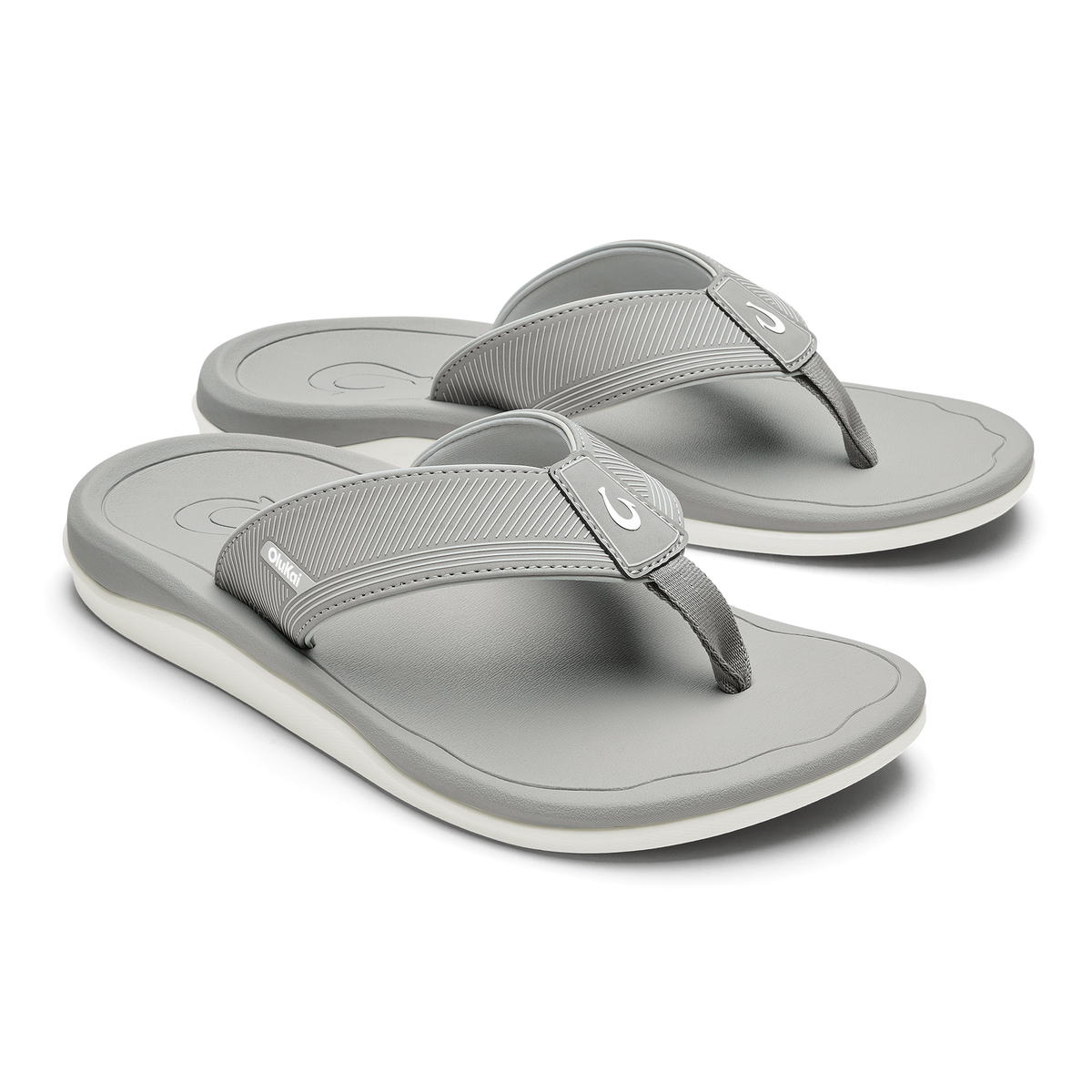Pair of ash gray thong sandals with ribbed fabric straps and white sole.