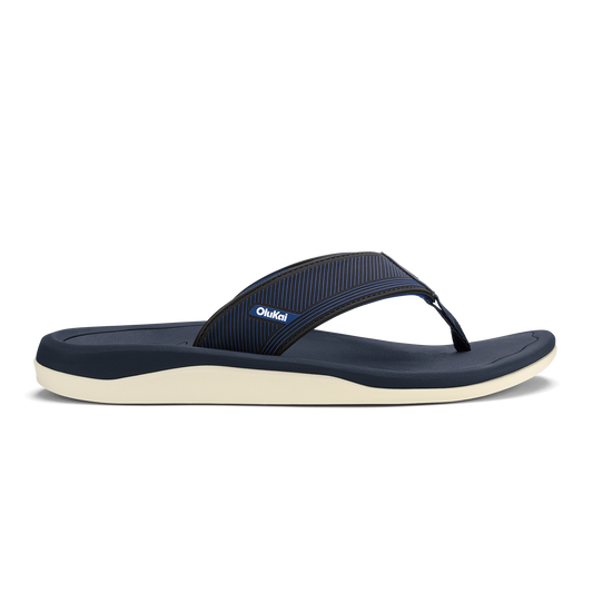 Navy blue thong sandal with ribbed toe strap and cream-colored sole.