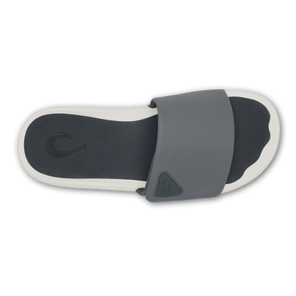 Gray and black slide sandal with white sole and adjustable strap, shown from above.
