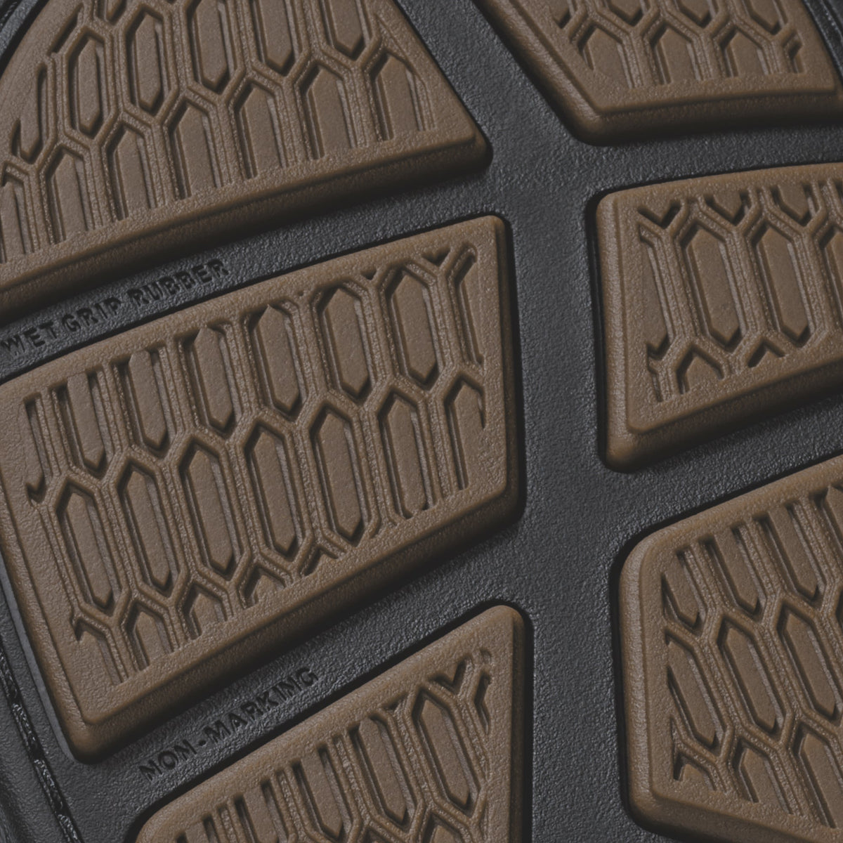 Brown and dark gray floor mats with geometric hexagonal tread pattern and raised edges.
