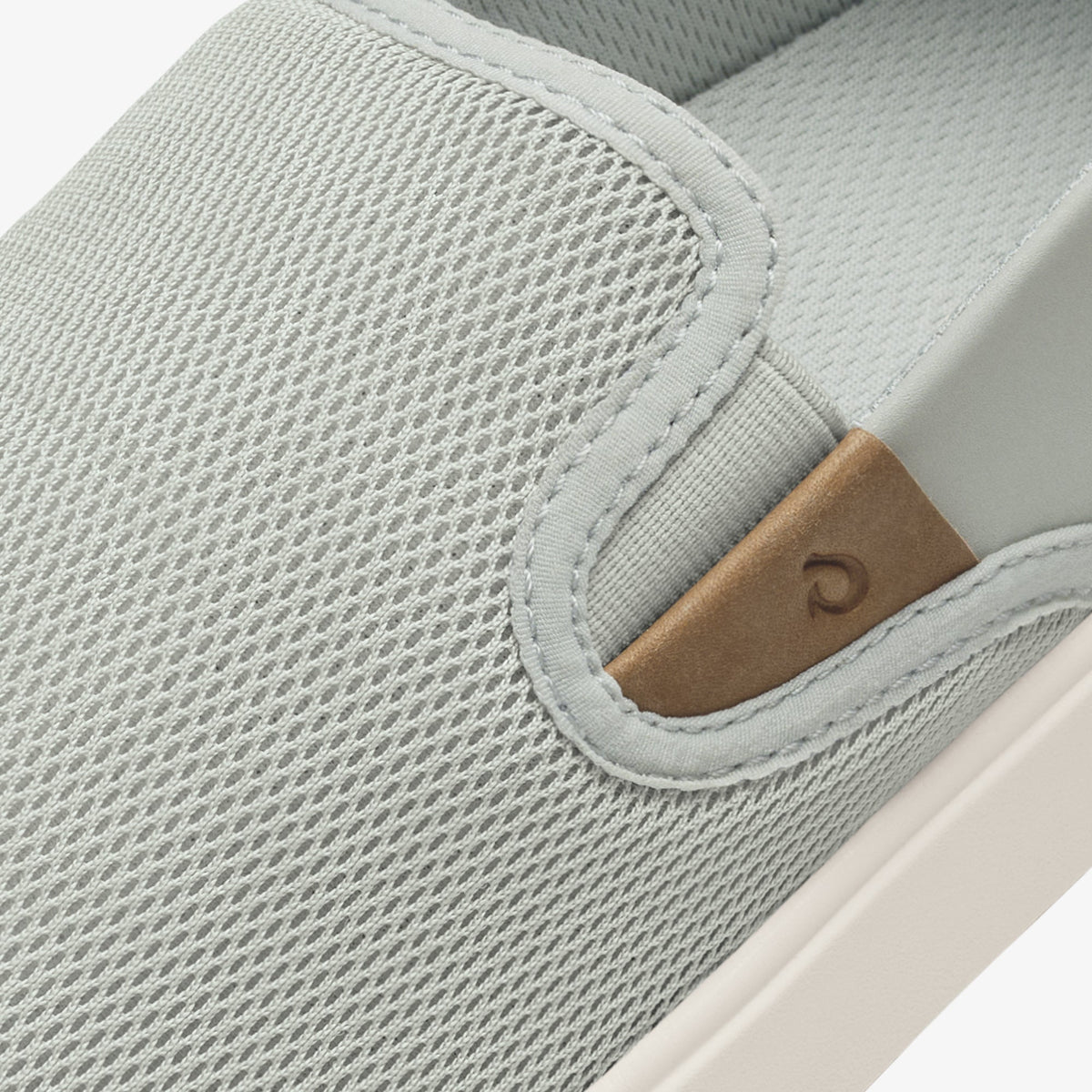 Cloud grey mesh slip-on shoe with tan leather heel tab and white sole.