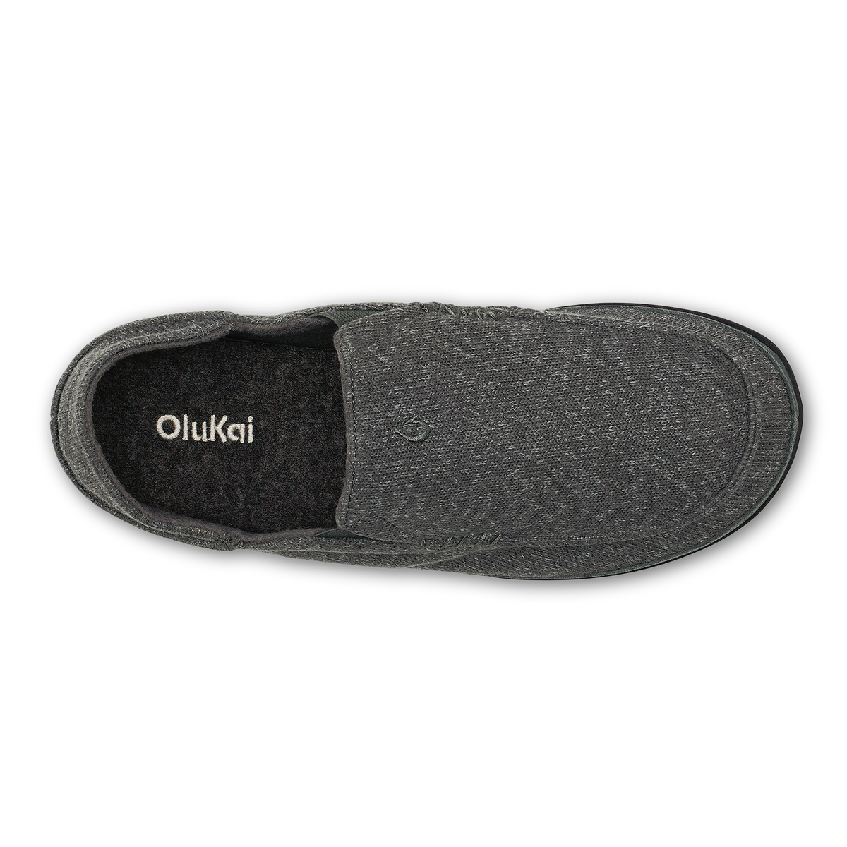 Dark gray knit slipper with black fleece lining, shown from above with OluKai branding visible inside.