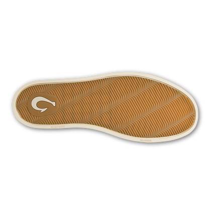Tan and dark brown chukka boot sole with textured pattern and white rubber trim.