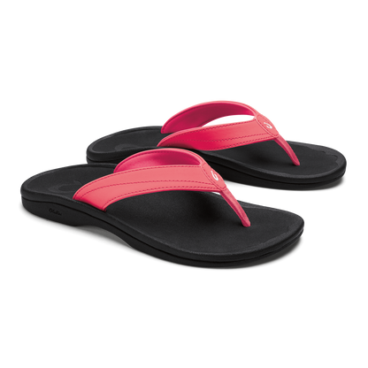 Pair of flip-flop sandals with hot pink straps and black soles, shown from above.