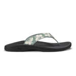 Thong sandal with silver-green floral printed strap and black cushioned footbed.