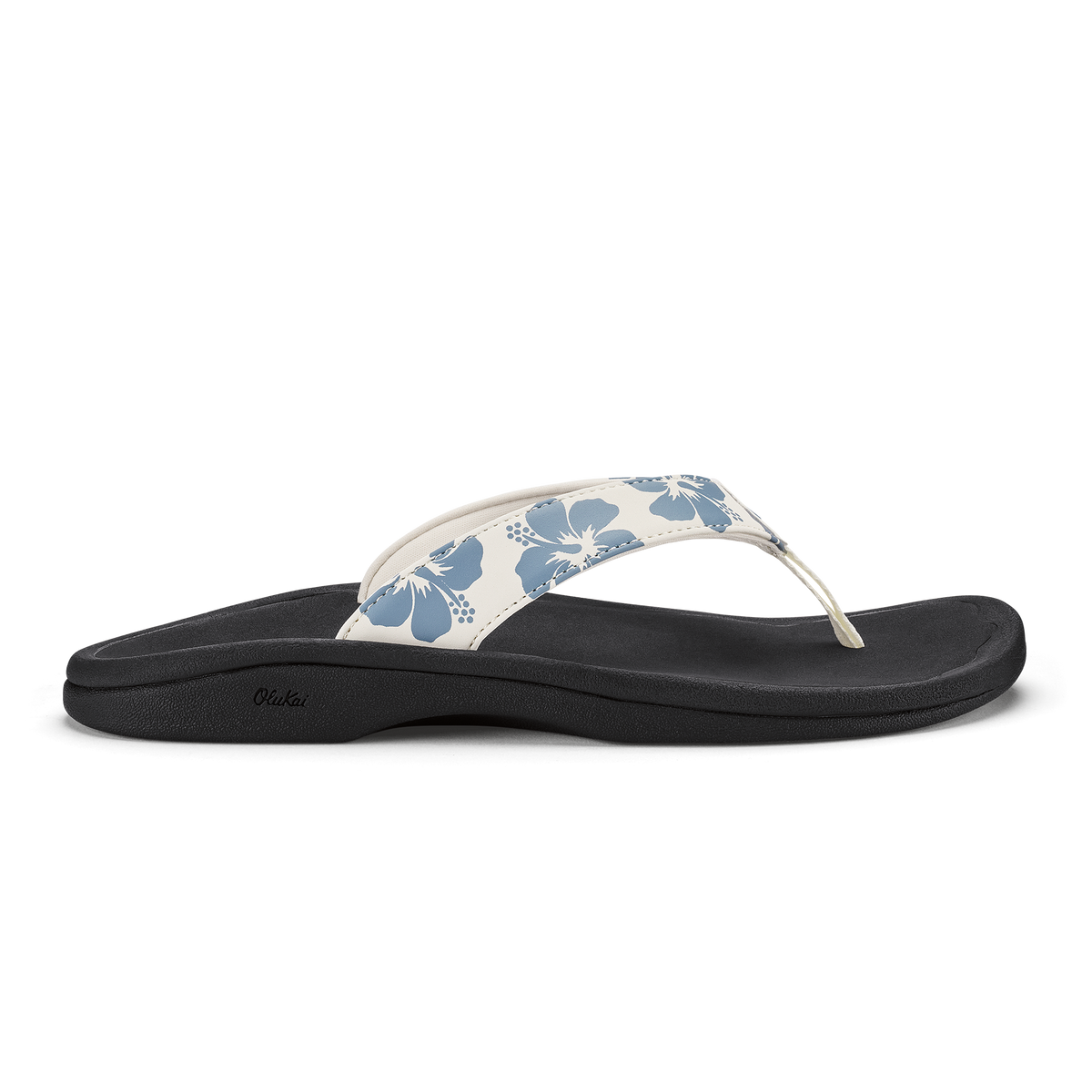 White and blue floral thong sandal with black sole and curved footbed.