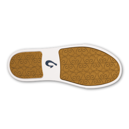 Sole view of lava rock colored slip-on shoe with tan patterned footbed and white midsole.