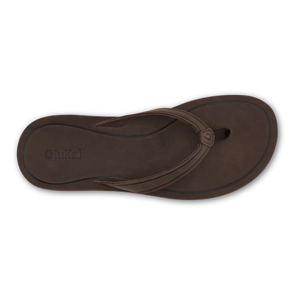 Dark brown leather thong sandal with curved straps and embossed OluKai branding on sole.