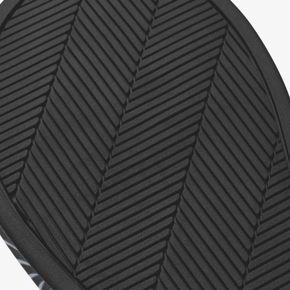 Black cushioned seat with herringbone quilted pattern and textured surface.