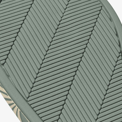 Silver-green cushion with chevron quilted pattern and leaf-shaped design detail.