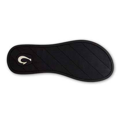 Black shoe sole with diagonal tread pattern and white curved logo on heel.
