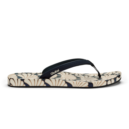 Blue and cream flip-flop with geometric patterned footbed and black toe strap.