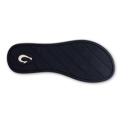 Dark navy sole with geometric tread pattern and white curved logo on heel.