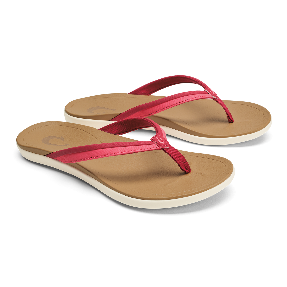 Pair of tan flip-flops with hot pink thong straps and cream-colored soles.