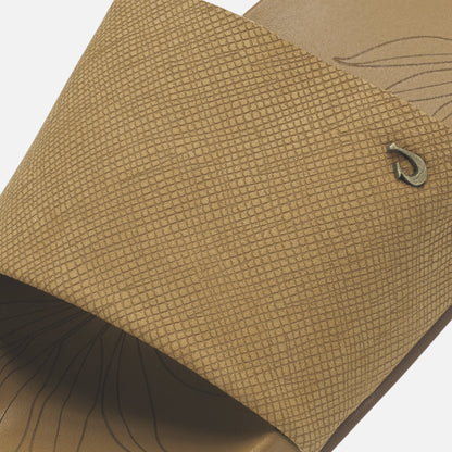 Tan crosshatch-textured sandal with dark brown sole and brand logo detail.