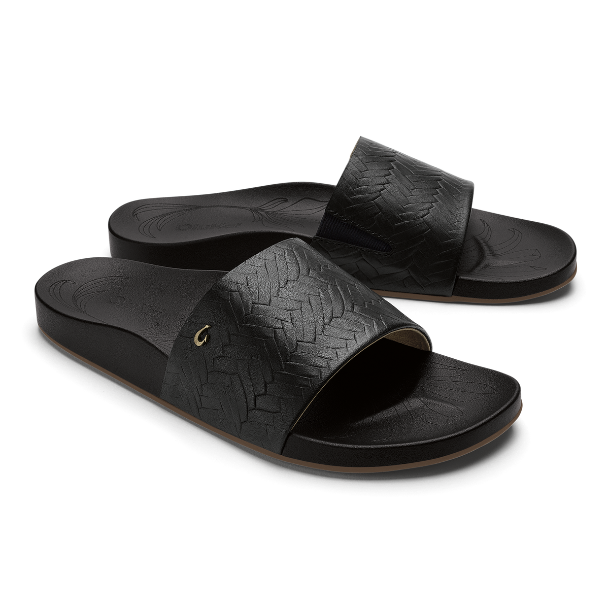 Black woven slide sandals with textured straps and cushioned footbeds.