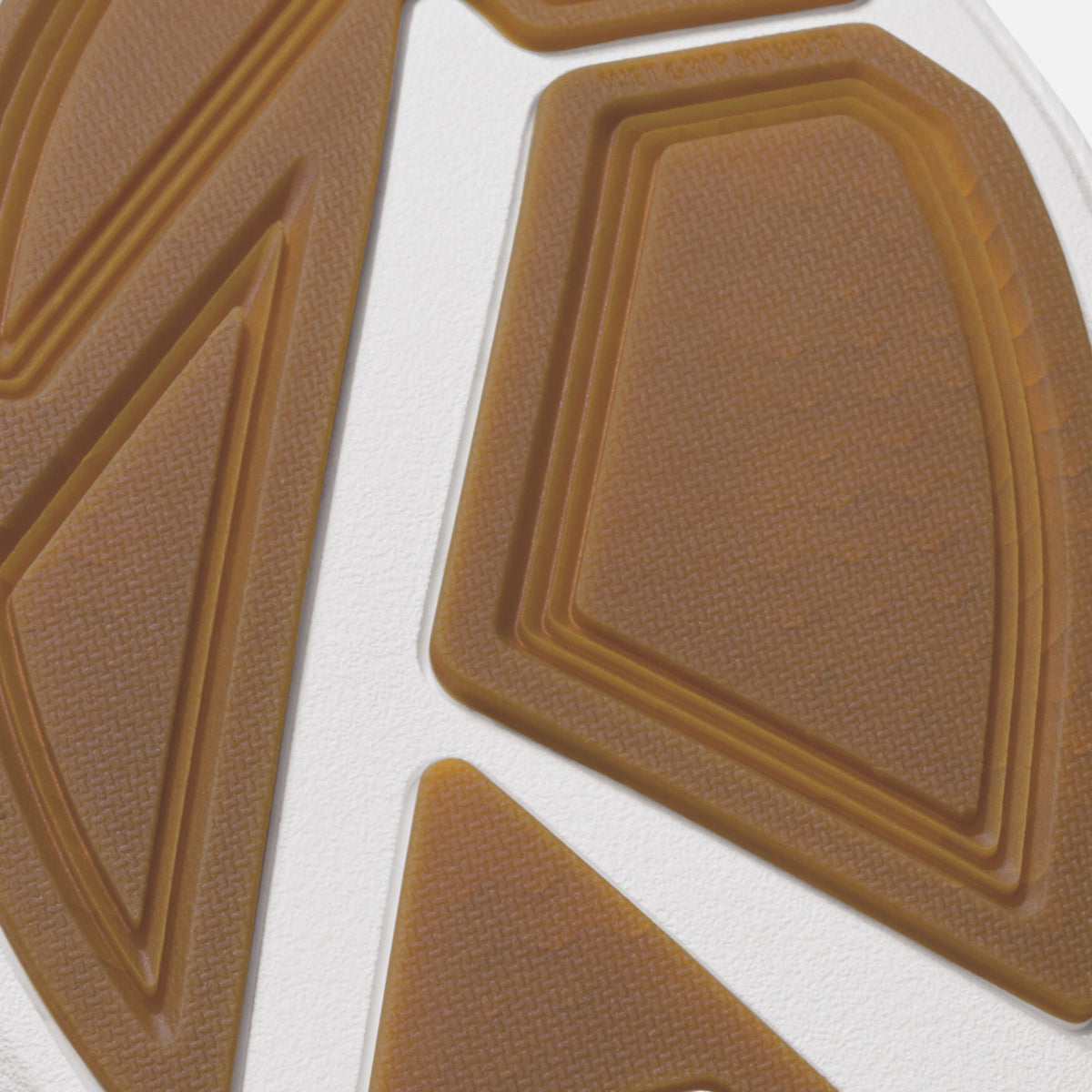 Tan sole with geometric pattern and concentric rectangular lines on textured surface.