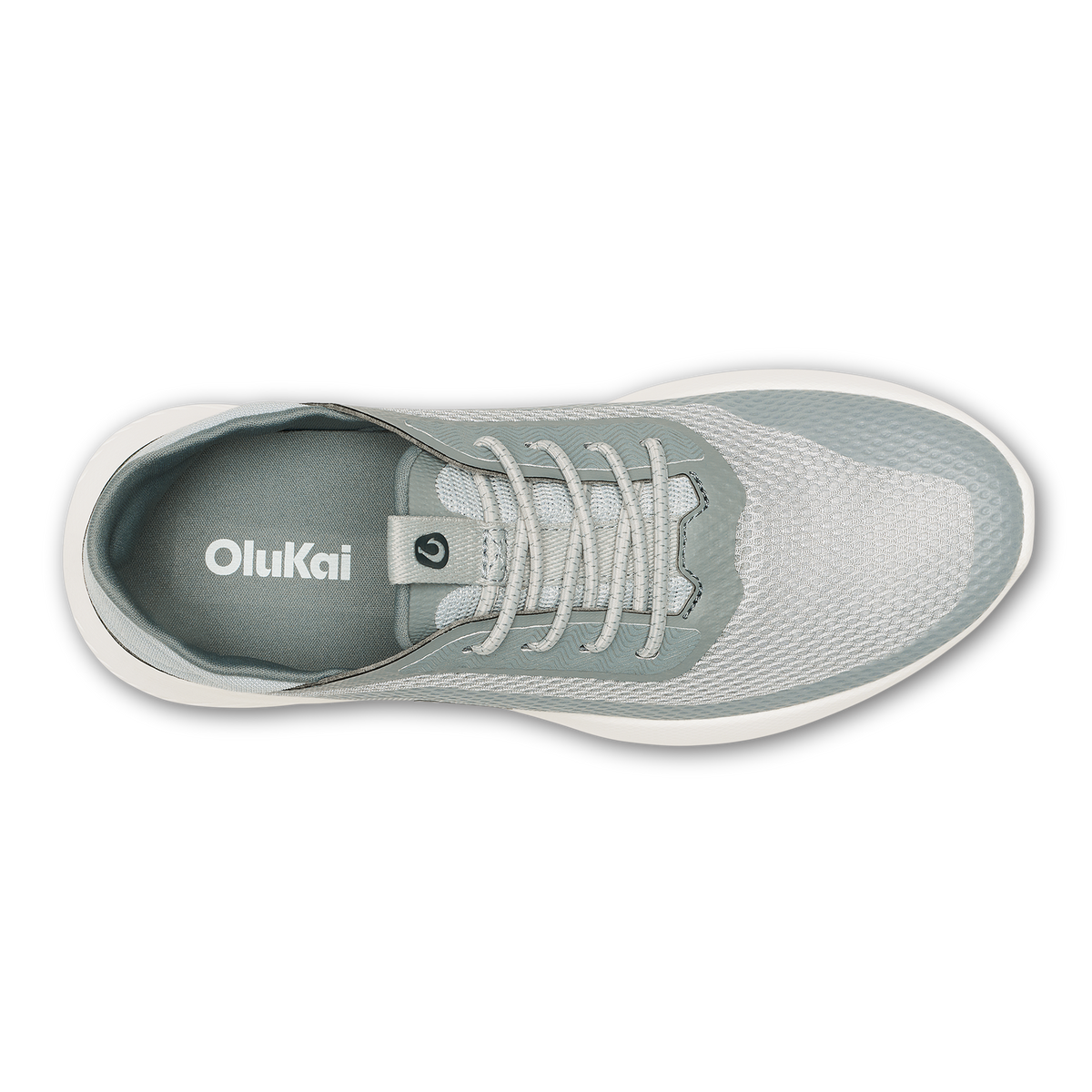 Top view of a gray and white OluKai lace-up sneaker with white sole and mesh upper.
