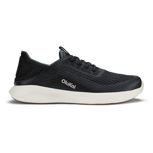 Black mesh running shoe with white sole and OluKai branding on the side.