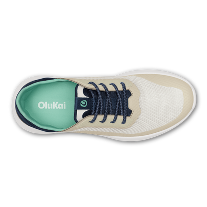 White and cream canvas sneaker with dark navy laces and mint green insole, viewed from above.