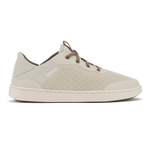 Cream-colored low-top sneaker with perforated mesh upper, brown laces, and cream rubber sole.
