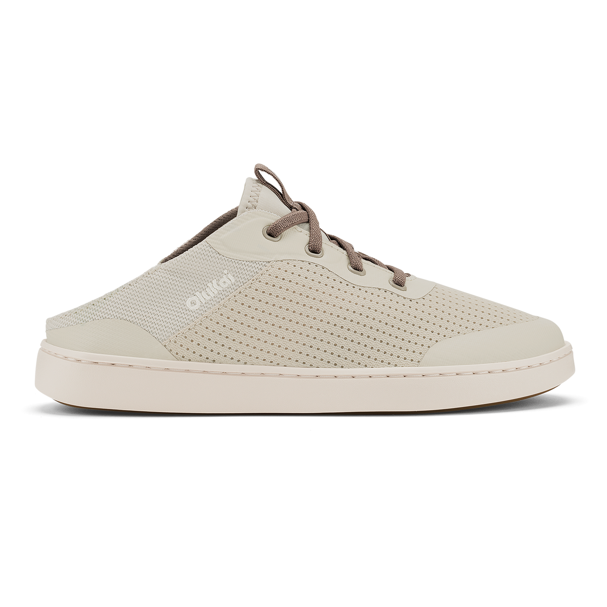 Cream-colored slip-on clog with perforated mesh upper, brown cord laces, and white rubber sole.