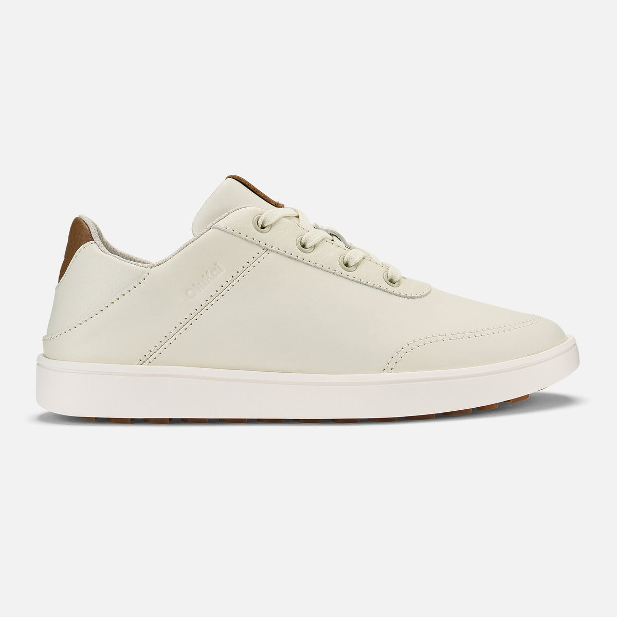White and tan lace-up sneaker with white sole and tan heel detail, shown in profile view.