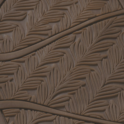 Warm sand-colored sole with leaf-pattern texture and two dark straps across the surface.