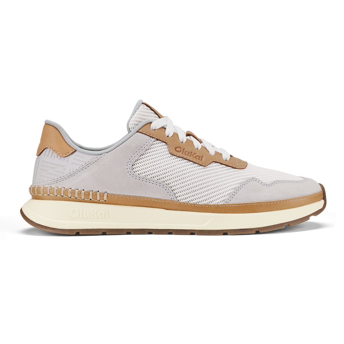 White and tan mesh running shoe with cream-colored sole and brown heel accent.