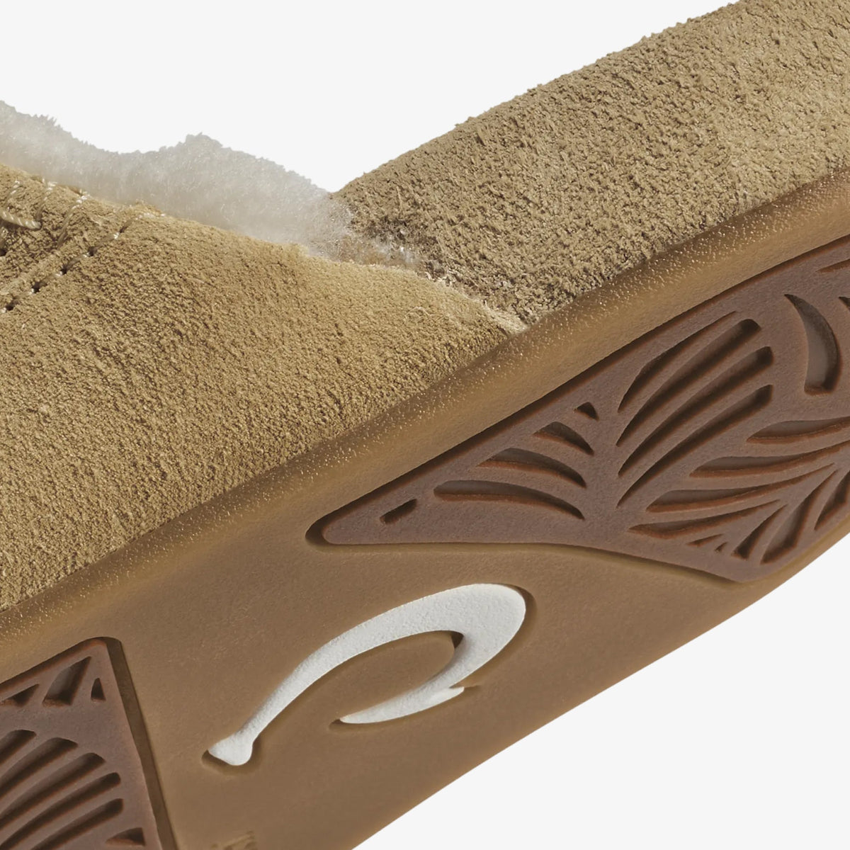 Tan textured straps with brown patterned sole featuring white curved logo detail.